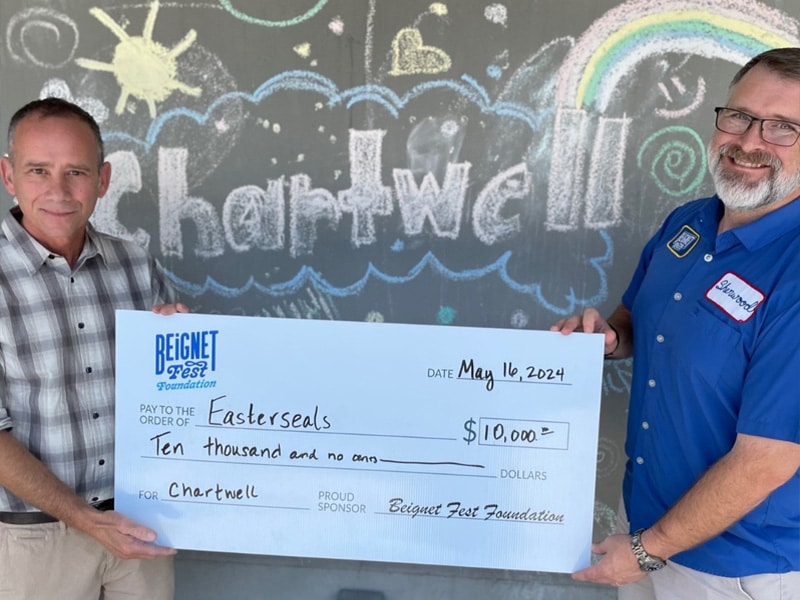 Beignet Fest Foundation presenting a check to local organizations Beignet Fest Foundation presenting a check to local organizations